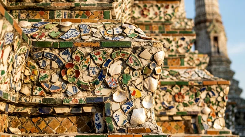 Close detail of Wat Arun prang decorated with broken porcelain and seashell mosaic